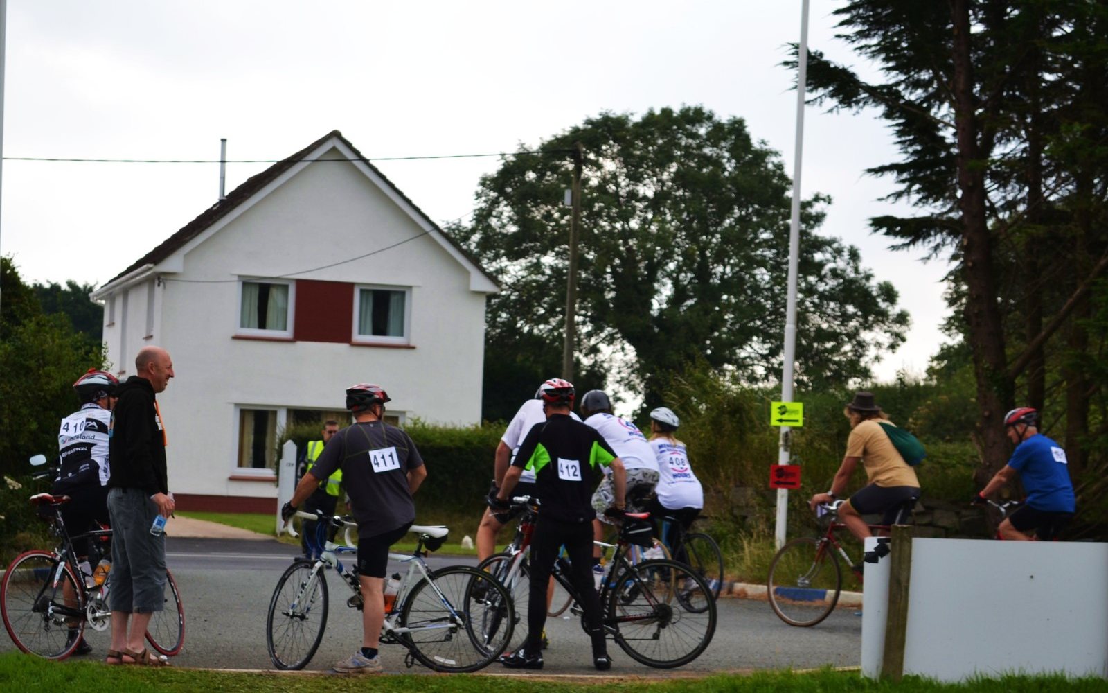 Cyclists riding in a charity event on a country road