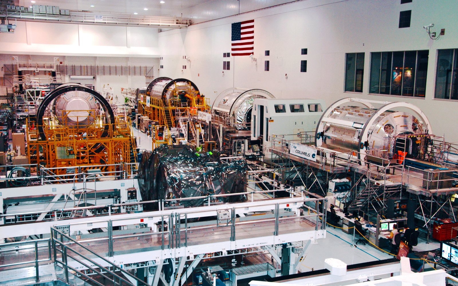 Workers and machinery on a manufacturing floor