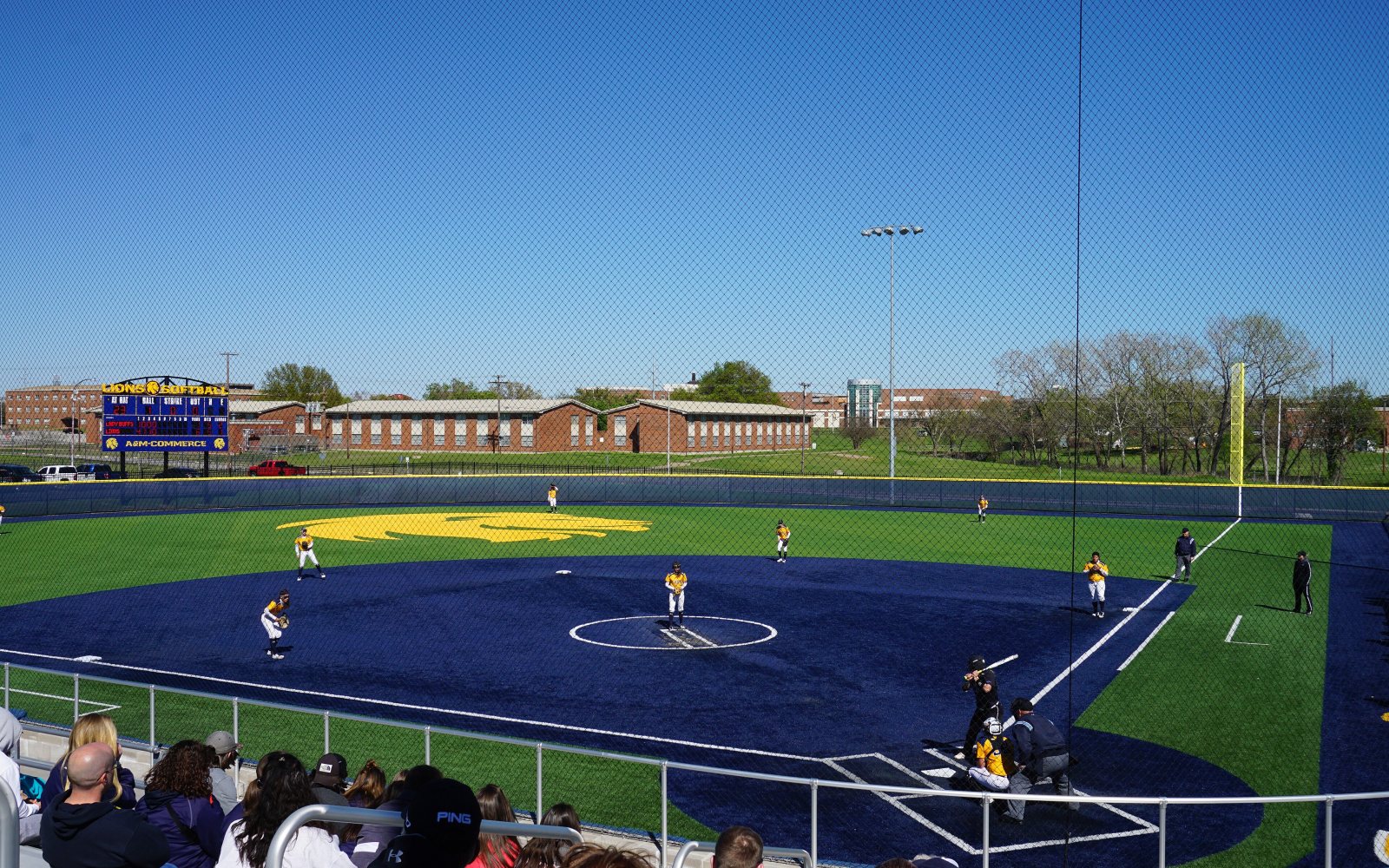 Softball pitcher delivering a pitch