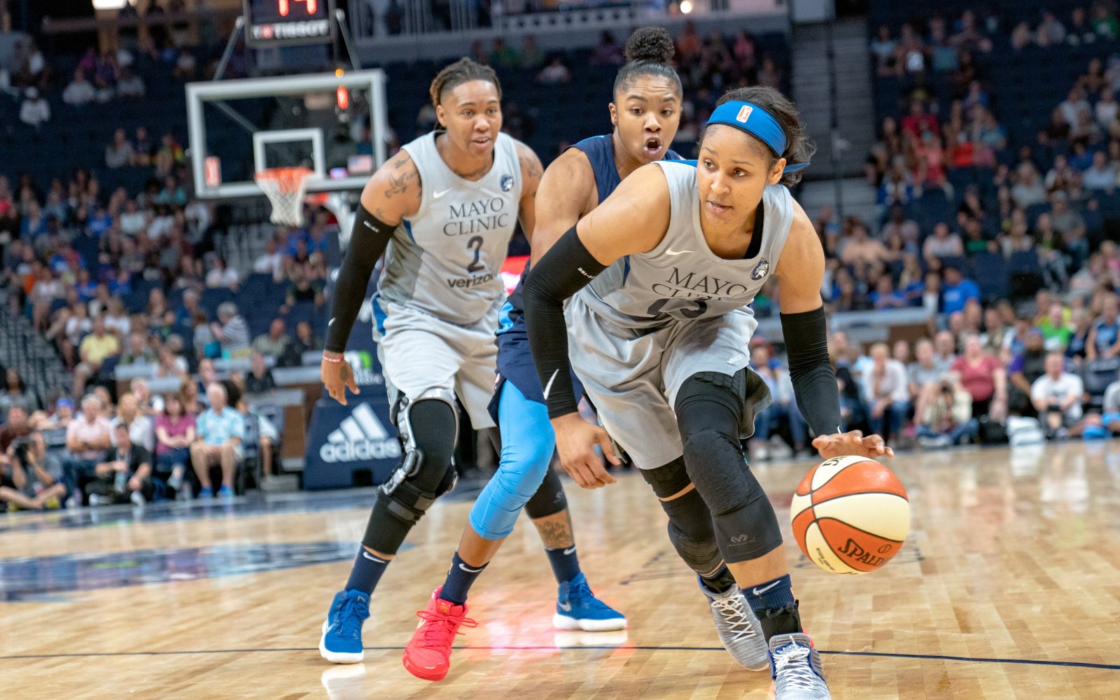 Basketball player dribbling up the court