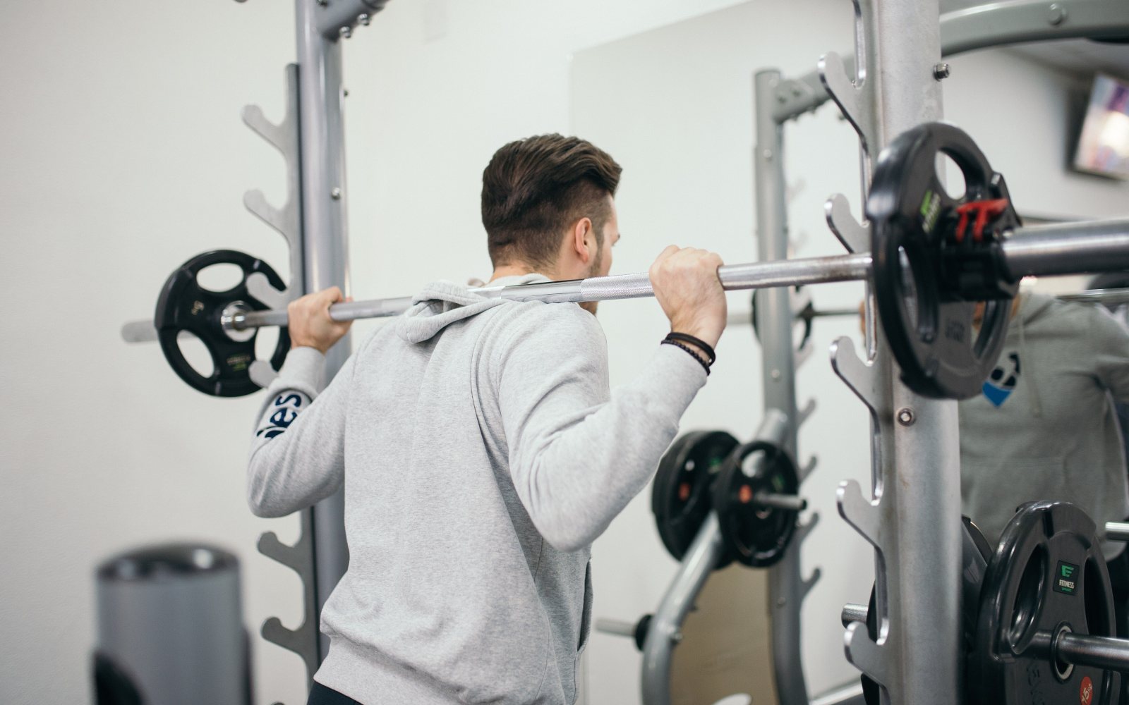 Barbell and weight plates in a gym