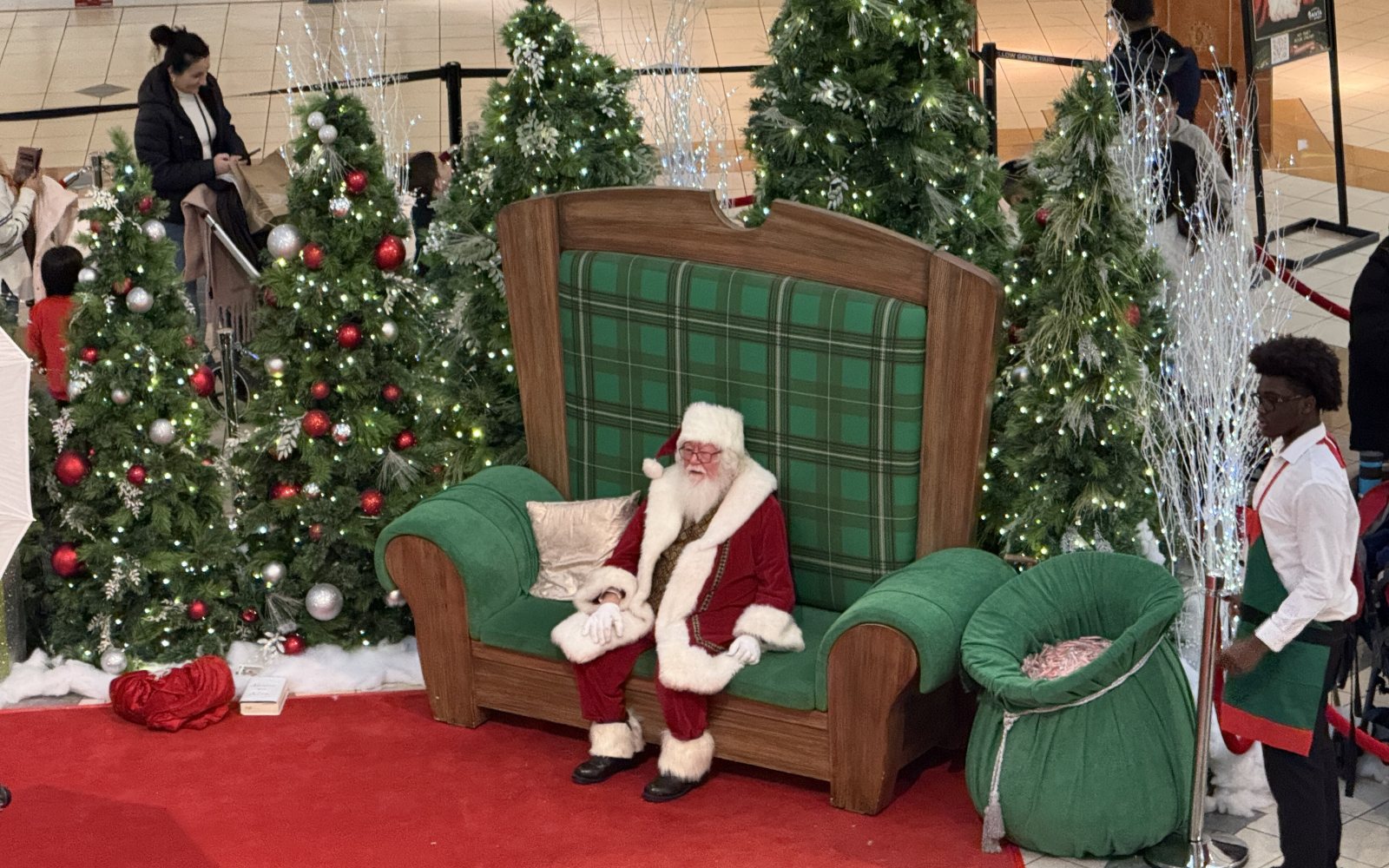 Santa Claus greeting visitors during the holiday season