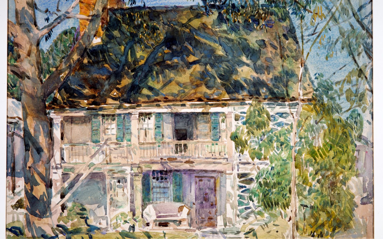 Watercolor paints and brushes on an artist's table