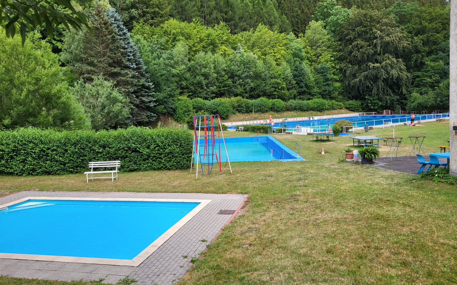 Outdoor public swimming pool on a summer evening