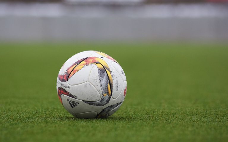 A soccer ball on a grass field