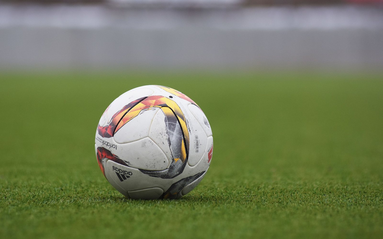 A soccer ball on a grass field