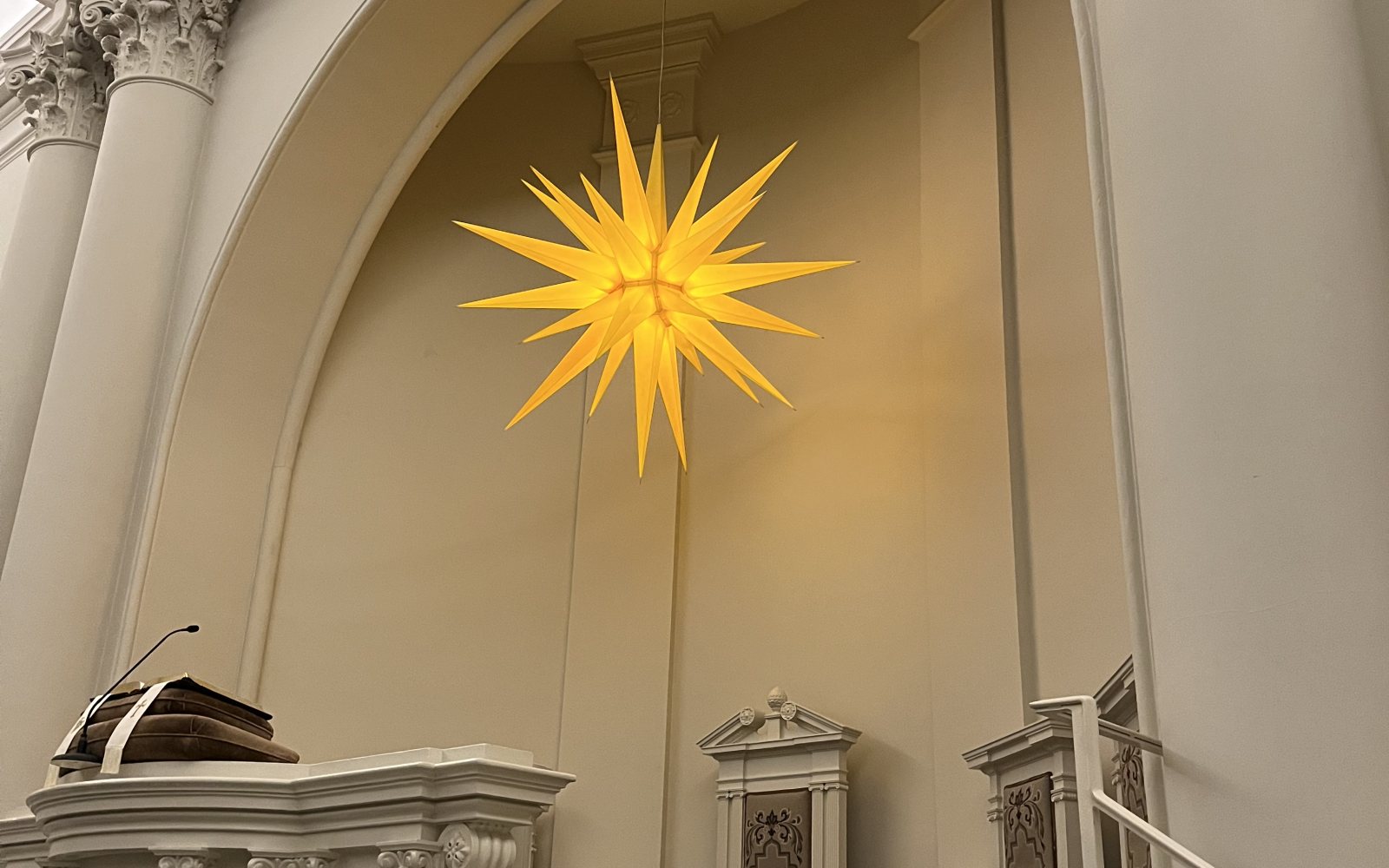 A lighted Moravian star hanging as a holiday decoration