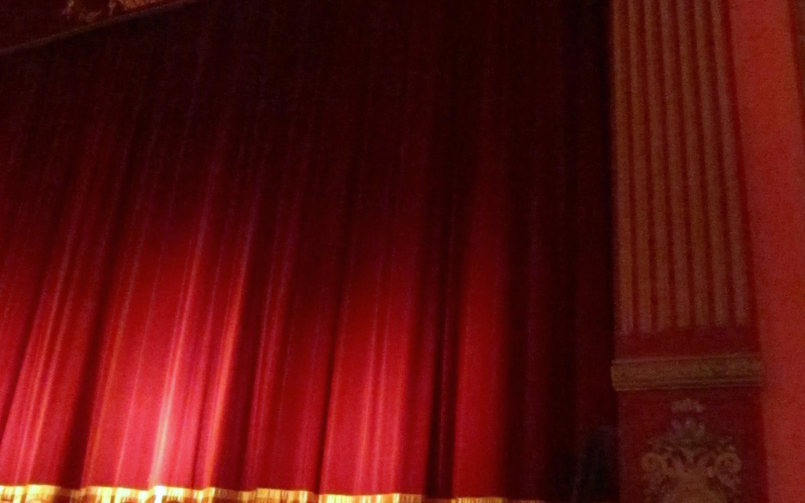 Theater stage with red curtains