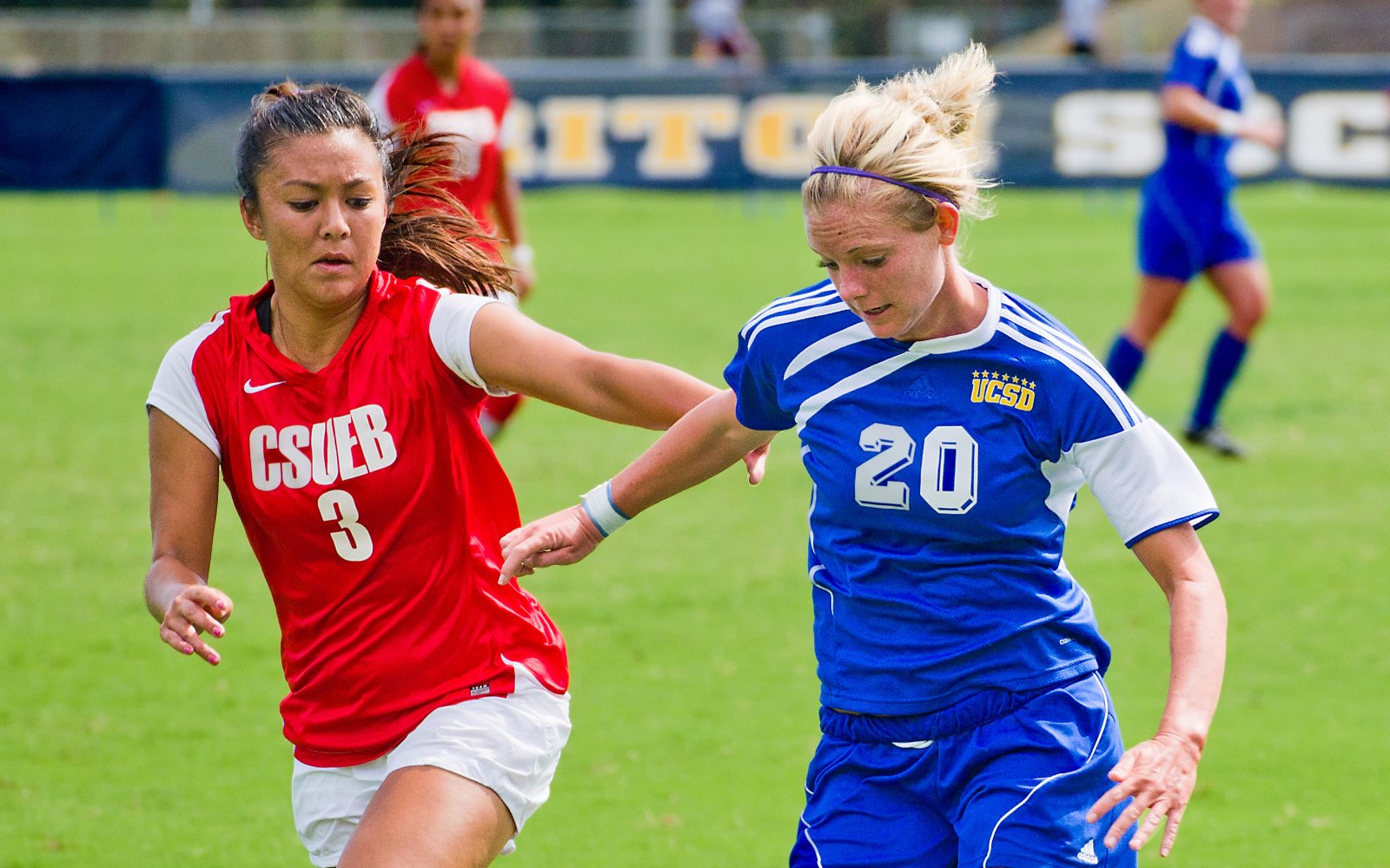Players compete for the ball in a soccer match