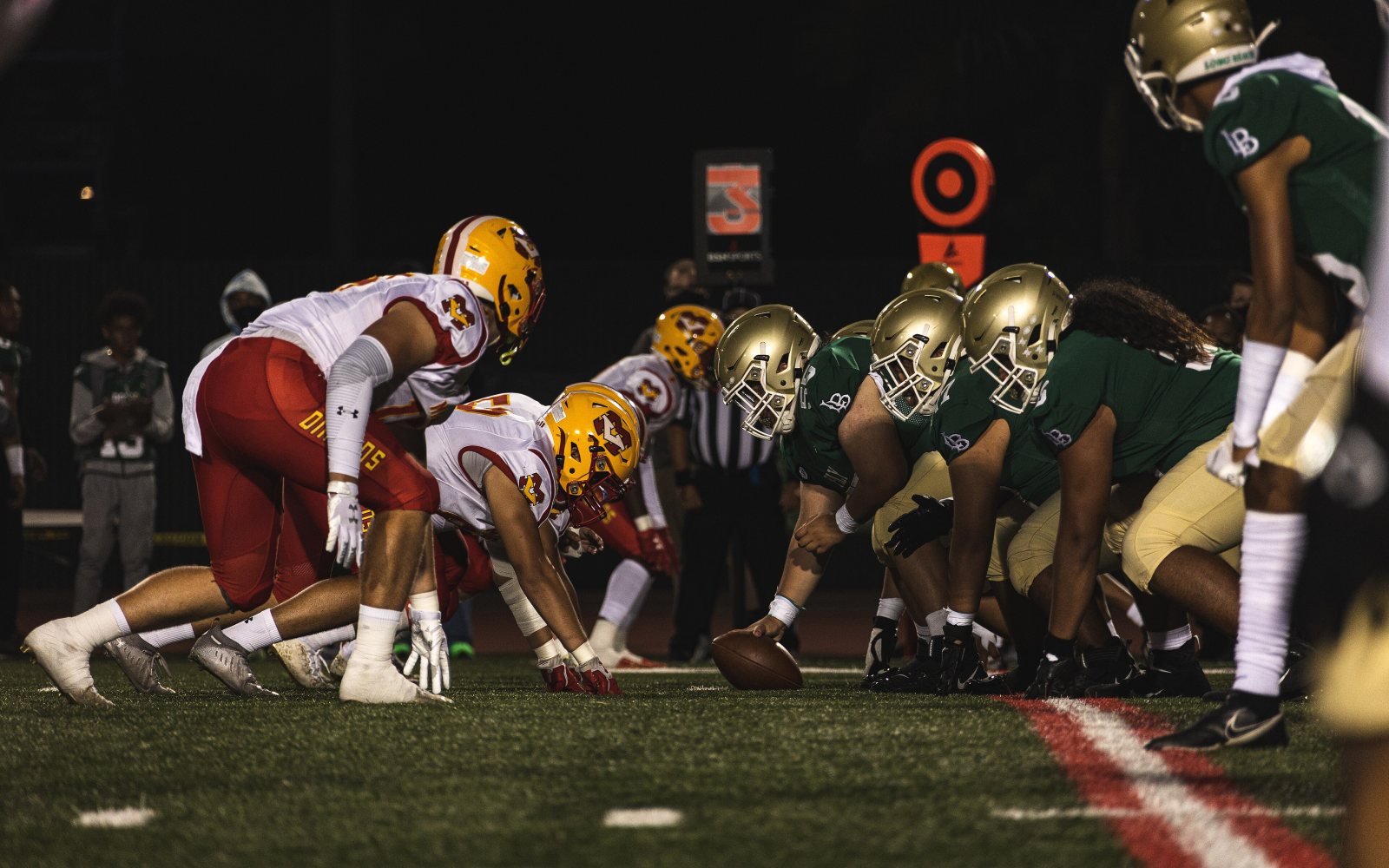 High school football players at the line of scrimmage